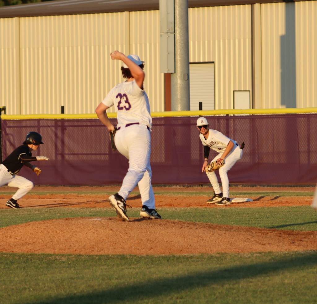 First baseman prepares to tag a runner near first base during play.