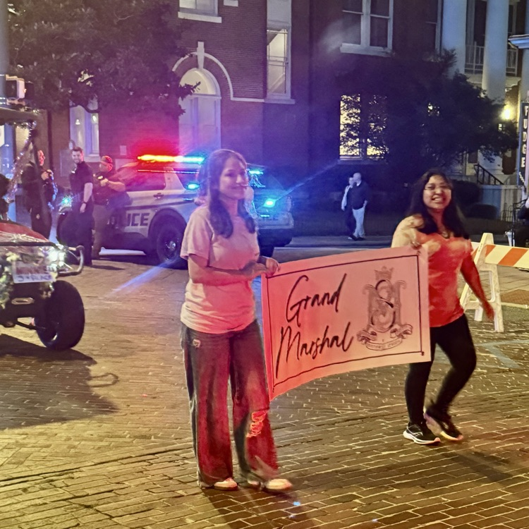 Anchor Club members Angelina Gomez-Roman and Angelica DeJesus helped marshal in the Grand Marshal at the Mardi Gras parade.