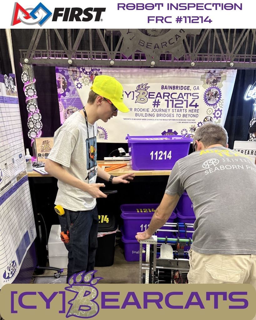 Robot Inspector checking all the wiring and hardware on FRC 11214's robot, KitCat.