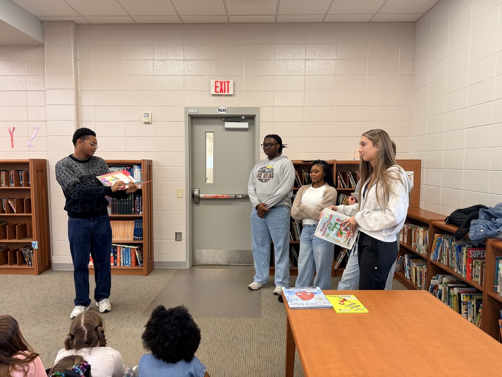 BHS Drama Club students reading to 2nd Graders