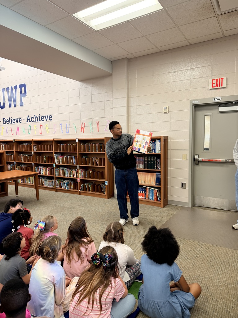 BHS Drama Troupe President Cam Whigham reading the 2nd Graders