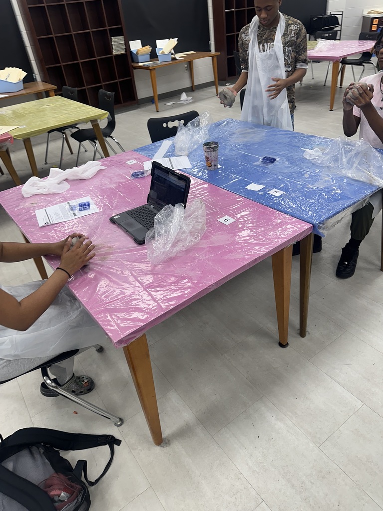 8th Grade students working with clay in Art Class.