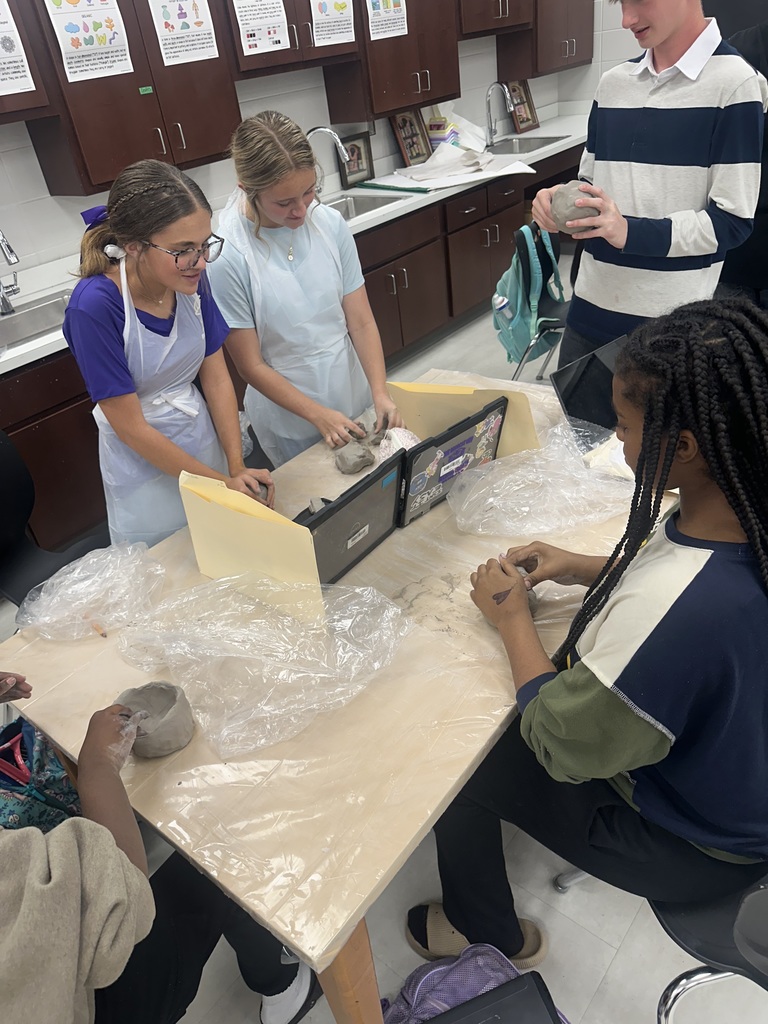8th Grade students working with clay in Art Class.