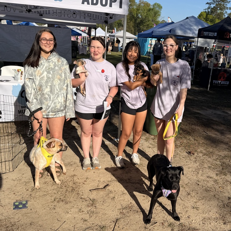Anchor Club members helped with a Humane Society adoption event at Rivertown Days. 