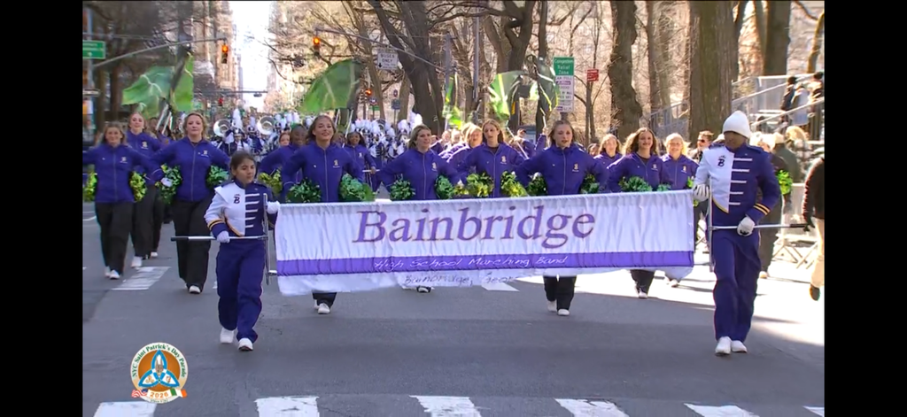 Bainbridge High School band marches in the NYC St. Patrick’s Day Parade holding a Bainbridge banner.