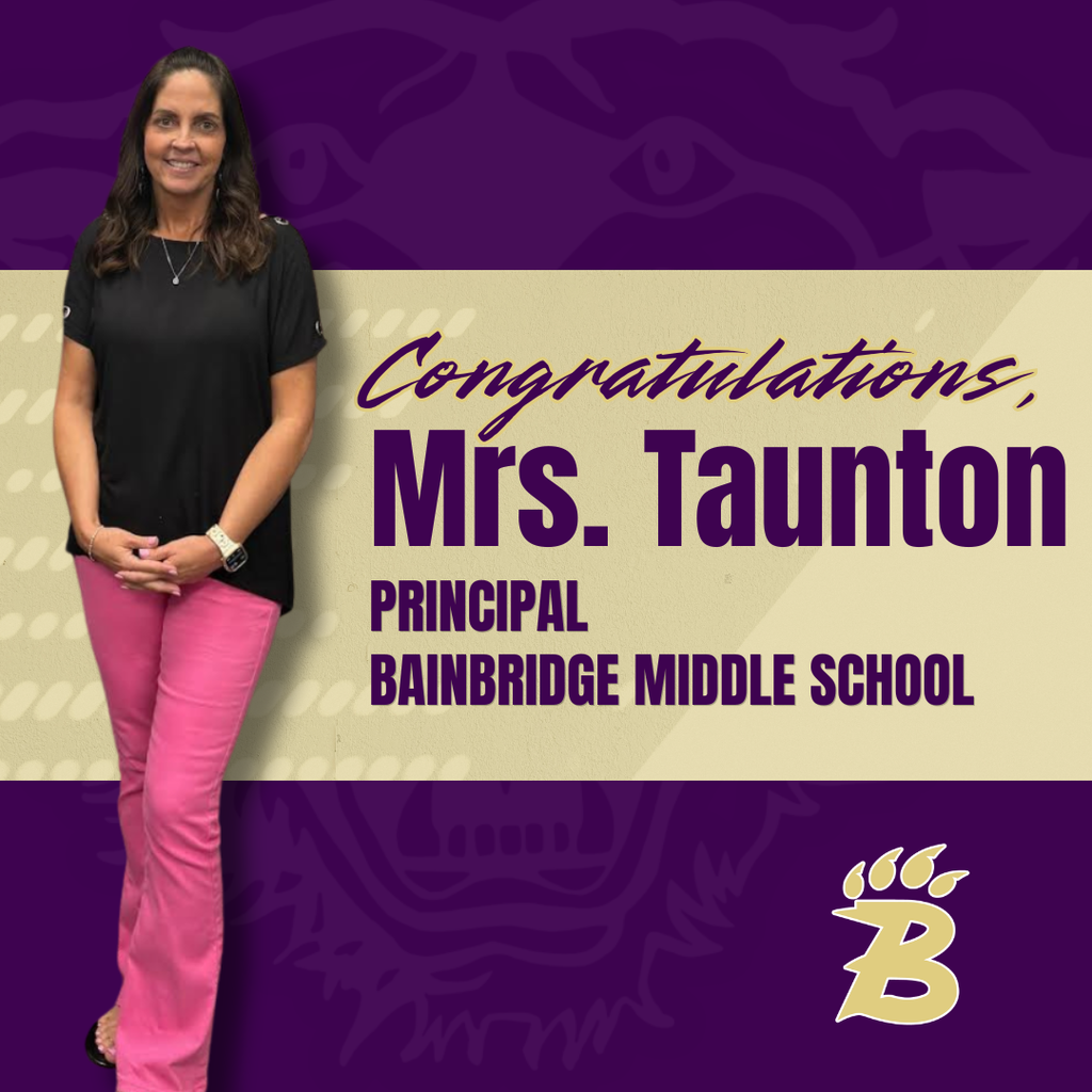 A congratulatory graphic featuring a smiling woman standing on the left, with text reading “Congratulations, Mrs. Taunton, Principal, Bainbridge Middle School” on a purple and gold background with a school-themed design.
