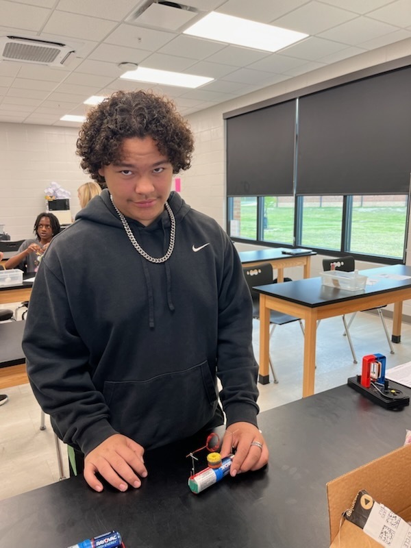 students work together  in lab classroom setting on motor design 