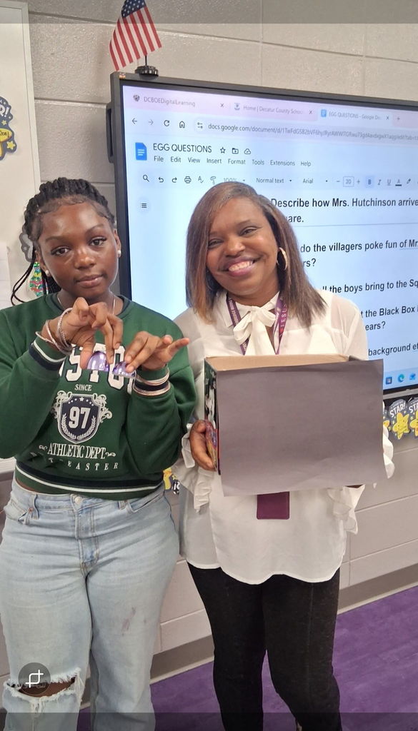 Student and teacher with their prize. 
