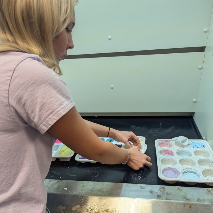 Mr. Kelley's chemistry class performed a percent yield lab with calcium carbonate, then joined up with Mrs. Cole's art class to make colorful homemade chalk they then used to decorate the sidewalks