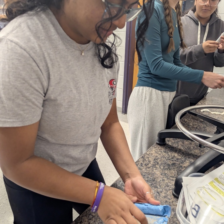 Mr. Kelley's chemistry class performed a percent yield lab with calcium carbonate, then joined up with Mrs. Cole's art class to make colorful homemade chalk they then used to decorate the sidewalks
