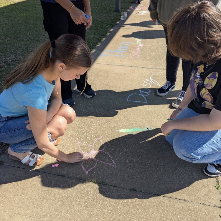 Mr. Kelley's chemistry class performed a percent yield lab with calcium carbonate, then joined up with Mrs. Cole's art class to make colorful homemade chalk they then used to decorate the sidewalks