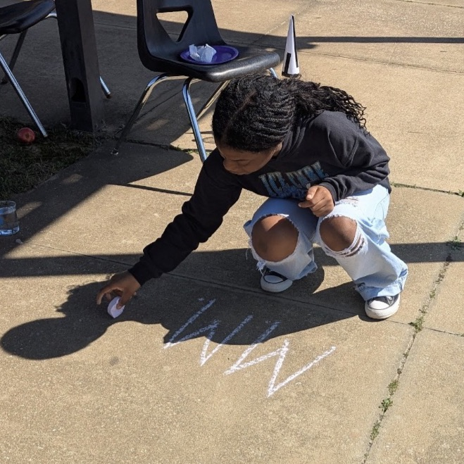 Mr. Kelley's chemistry class performed a percent yield lab with calcium carbonate, then joined up with Mrs. Cole's art class to make colorful homemade chalk they then used to decorate the sidewalks
