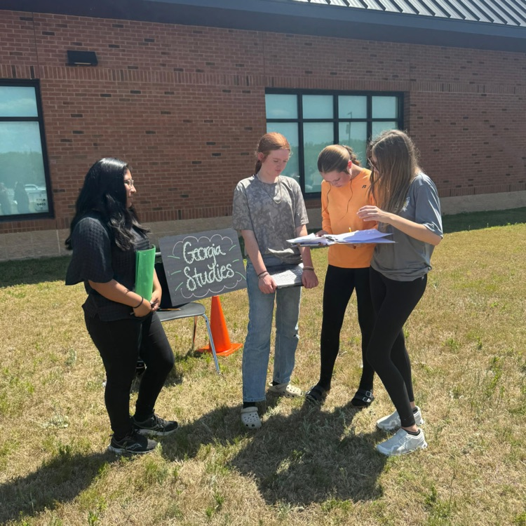 Anchor Club and Key Club members and basketball cheerleaders belped with the BMS Decathlon. 