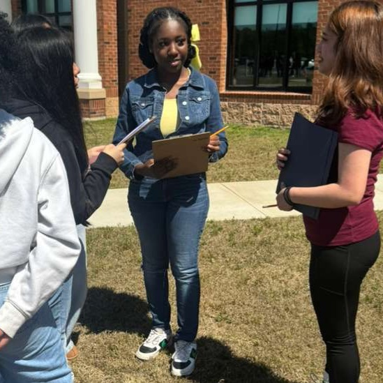 Anchor Club and Key Club members and basketball cheerleaders belped with the BMS Decathlon. 