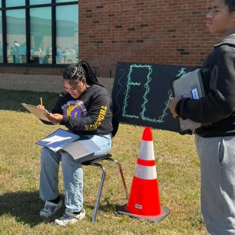 Anchor Club and Key Club members and basketball cheerleaders belped with the BMS Decathlon. 