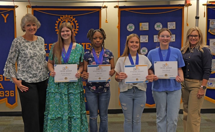 Serenity Rivera (9th grade Honorable Mention ), Jada Teal (10th grade Honorable Mention), Evynn Huggins (11th grade Winner) and Jacee Brock (12th grade and School Winner) read their Laws of Life essays to Rotary on Tuesday. 