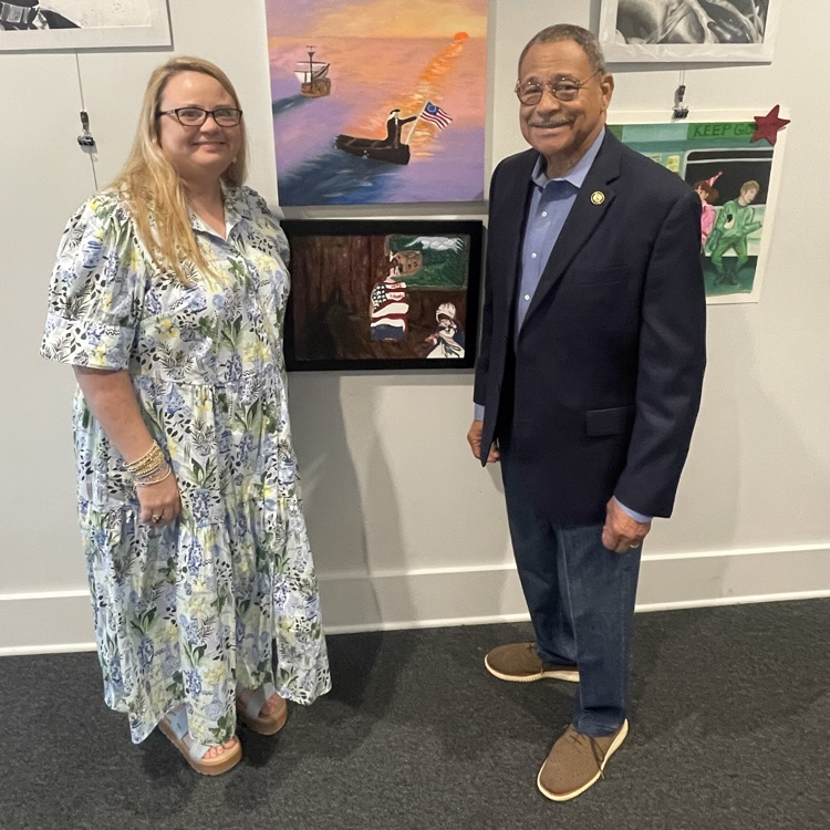 Mrs. Cole and Rep. Sanford Bishop admire the artwork of BHS students (exhibited in background) at the Albany Museum of Art. 