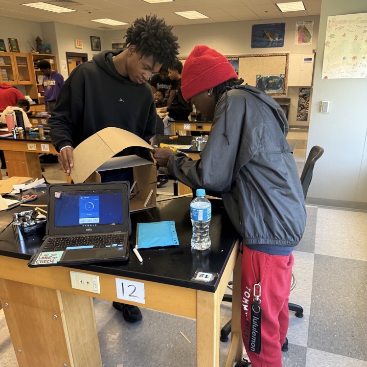 Students in Mrs. McDonald's Environmental Science classes designed, constructed, and tested structures that used wind and solar energy to power LED bulbs.