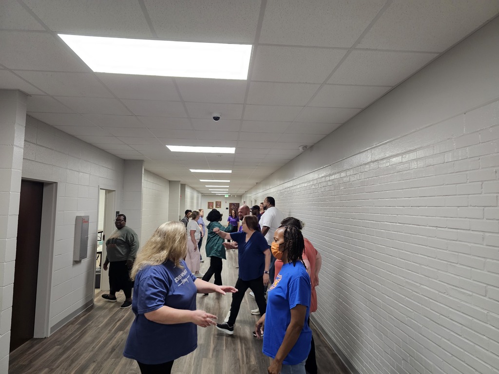 staff in hallway practicing skills