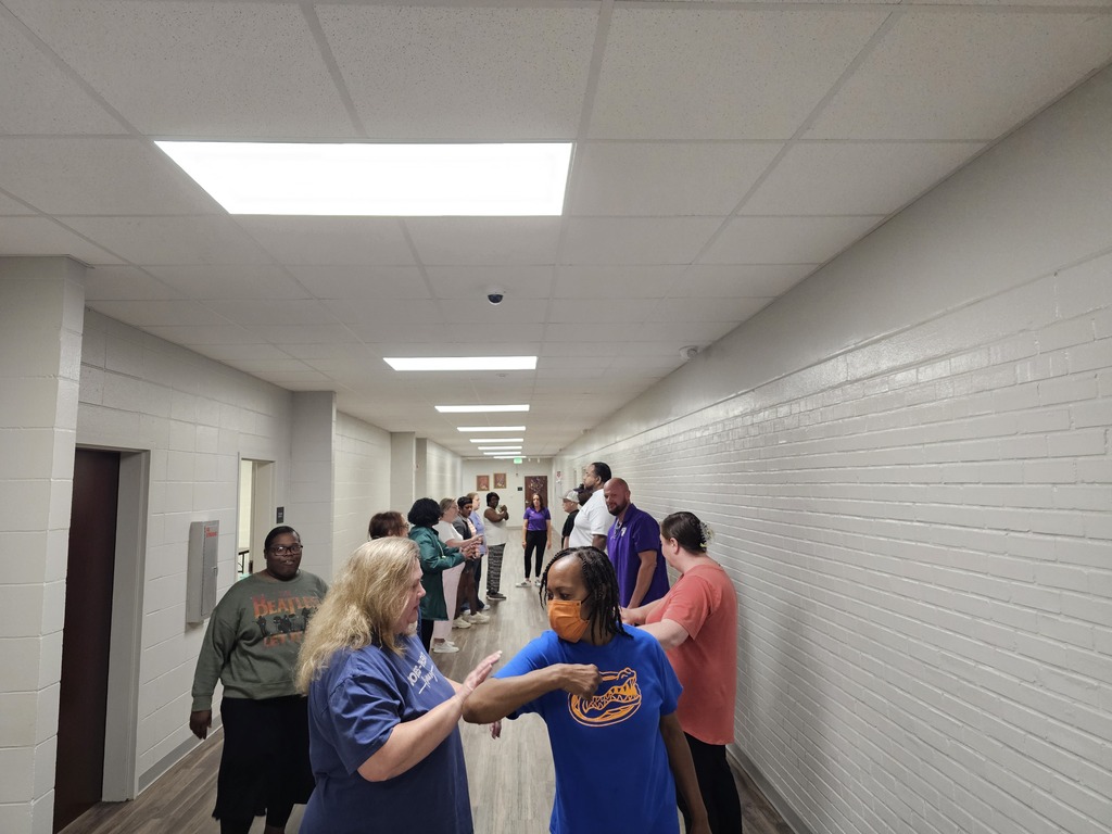 staff in hallway practicing skills