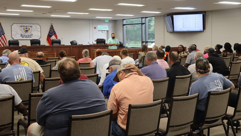 Transportation employees attend a safety meeting in the Decatur County Schools boardroom 