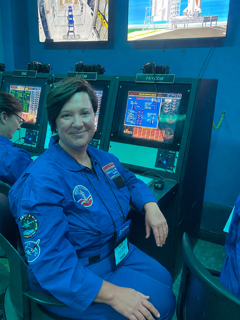 A collection of photos showing Hutto Elementary NASA HUNCH teachers participating in Space Camp activities, including astronaut training simulations, Mission Control exercises, team-building challenges, hands-on STEM workshops, and group photos at the U.S. Space & Rocket Center.