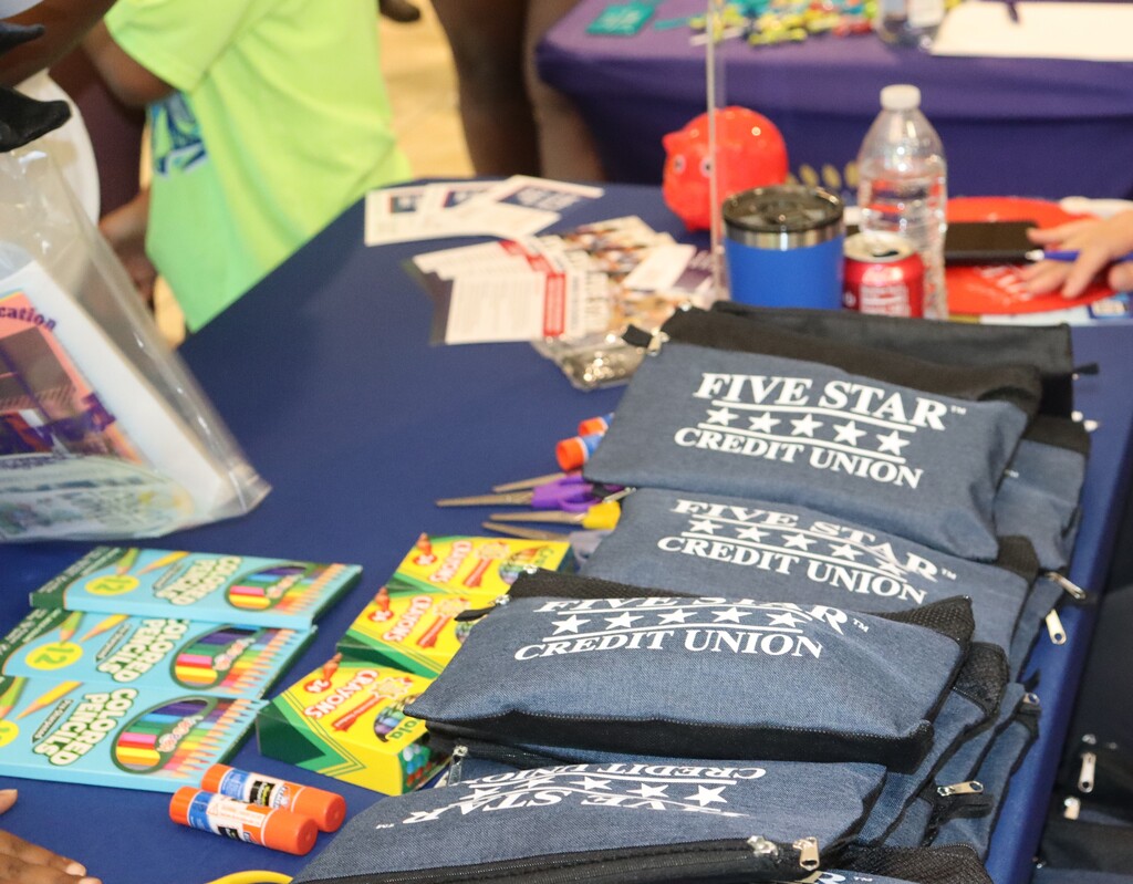Five Star Credit Union provides pencil pouches, crayons and glue sticks at Bearcat Blitz.