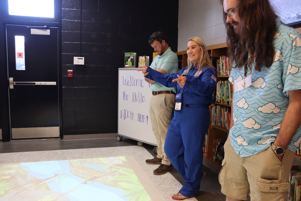 IMG_0999.JPG: Educators experience interactive floor technology inside the Hutto Media Hub.