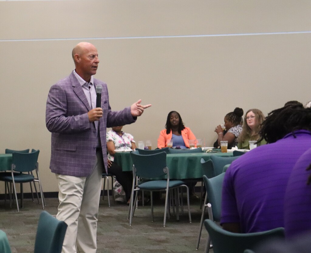 Photos from the August Chamber Connect Luncheon featuring Bainbridge Bearcat Head Football Coach Jamey DuBose speaking to community members and introducing Bearcat football players. First National Bank sponsored the event, which brought together Bearcat Football, school representatives, and community partners ahead of the upcoming football season.
