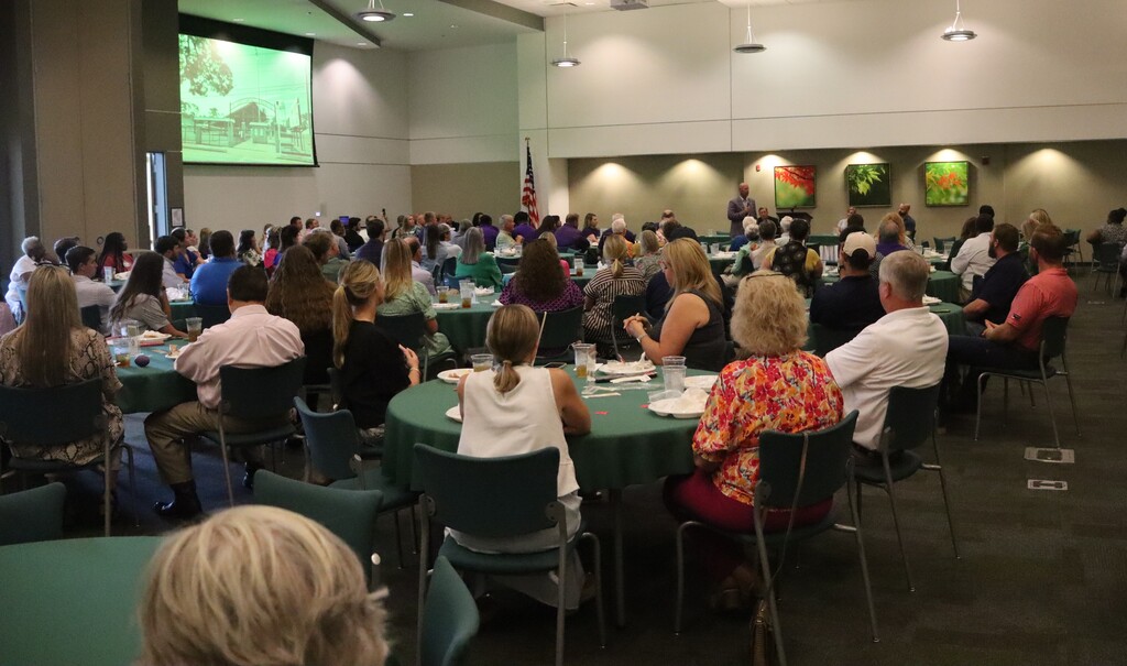 Photos from the August Chamber Connect Luncheon featuring Bainbridge Bearcat Head Football Coach Jamey DuBose speaking to community members and introducing Bearcat football players. First National Bank sponsored the event, which brought together Bearcat Football, school representatives, and community partners ahead of the upcoming football season.