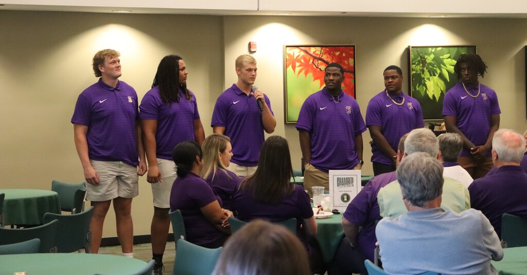 Photos from the August Chamber Connect Luncheon featuring Bainbridge Bearcat Head Football Coach Jamey DuBose speaking to community members and introducing Bearcat football players. First National Bank sponsored the event, which brought together Bearcat Football, school representatives, and community partners ahead of the upcoming football season.
