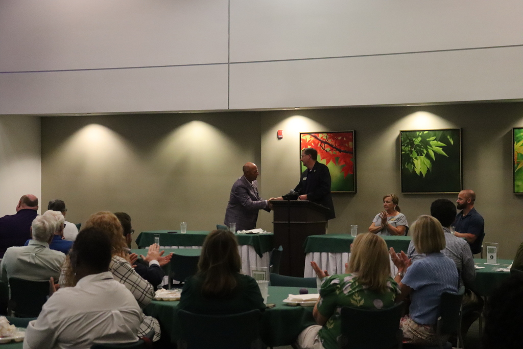 Photos from the August Chamber Connect Luncheon featuring Bainbridge Bearcat Head Football Coach Jamey DuBose speaking to community members and introducing Bearcat football players. First National Bank sponsored the event, which brought together Bearcat Football, school representatives, and community partners ahead of the upcoming football season.