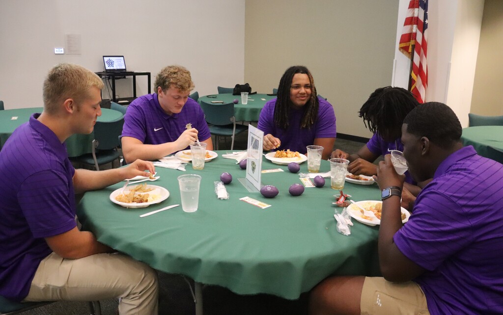 Photos from the August Chamber Connect Luncheon featuring Bainbridge Bearcat Head Football Coach Jamey DuBose speaking to community members and introducing Bearcat football players. First National Bank sponsored the event, which brought together Bearcat Football, school representatives, and community partners ahead of the upcoming football season.