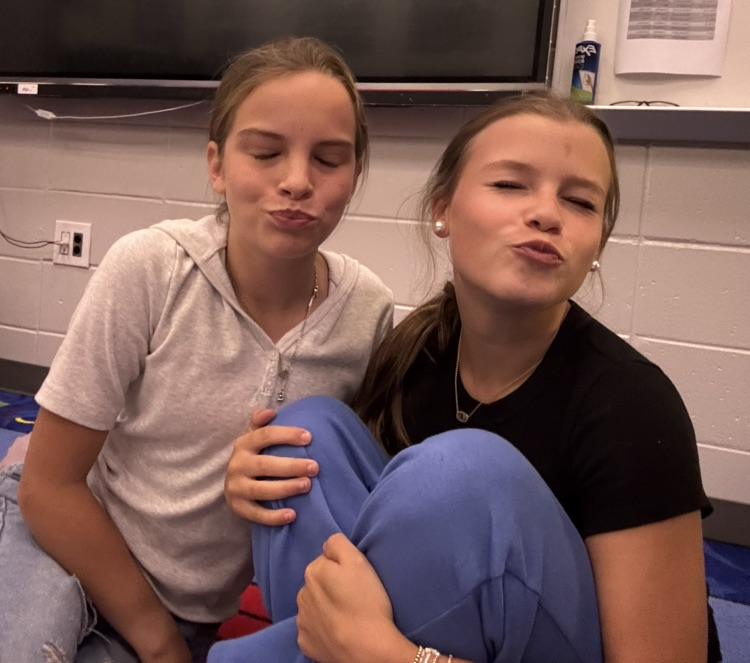 Two eighth grade students pose for a picture