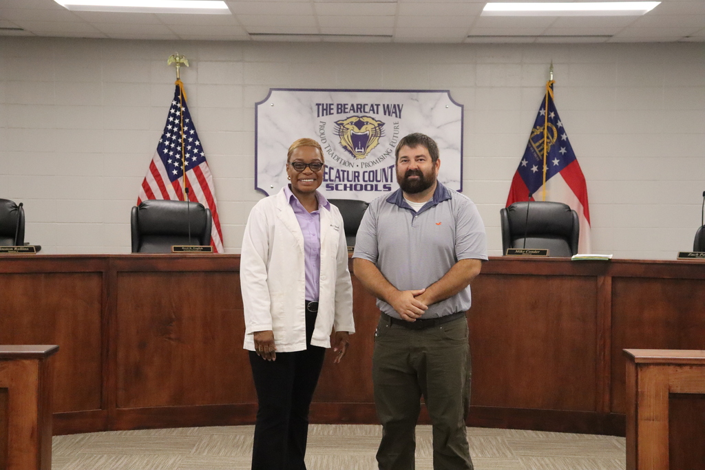 Two presenters pose in the Decatur County Schools boardroom following a parent and family engagement presentation.