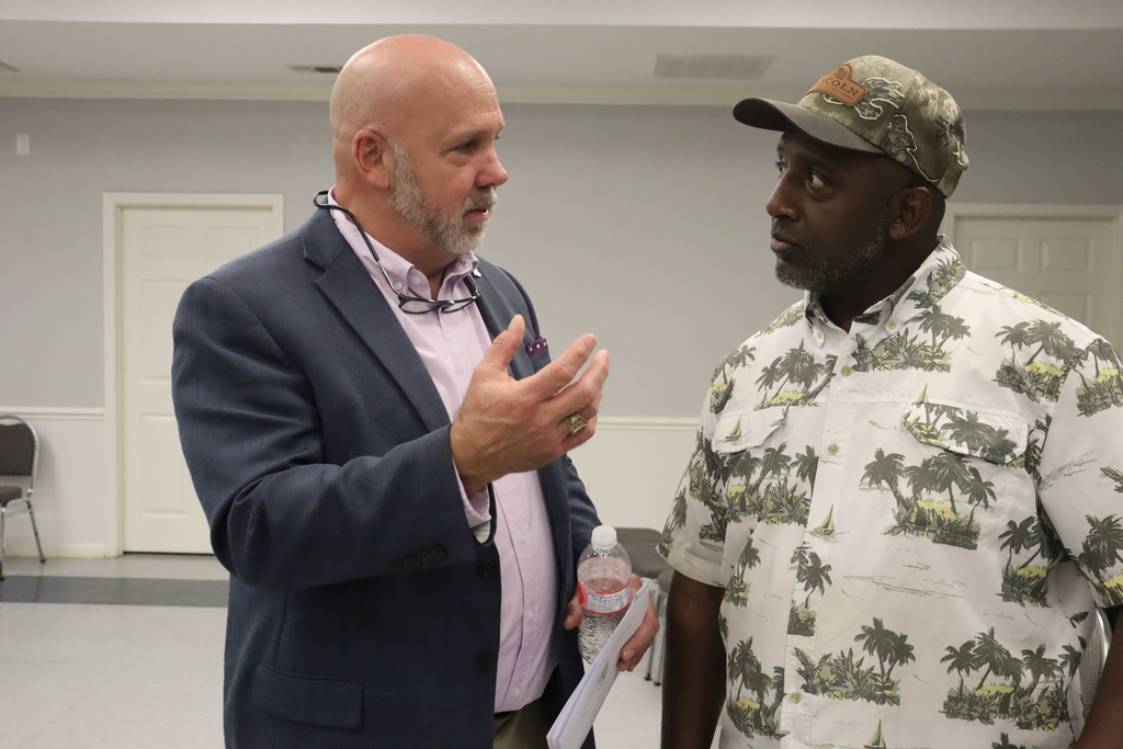 two men having a conversation candidly
