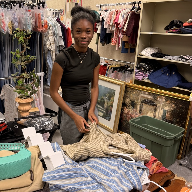 Anchor Club members help sort and price items for their mega yard sale which will be August 14th