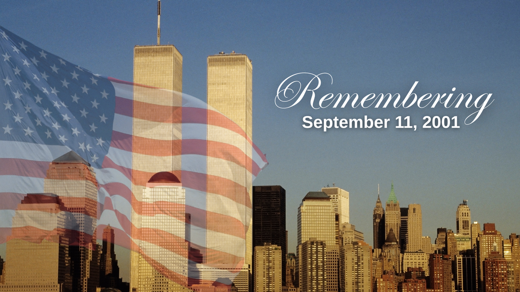 American flag over the New York City skyline and Twin Towers with the words “Remembering September 11, 2001