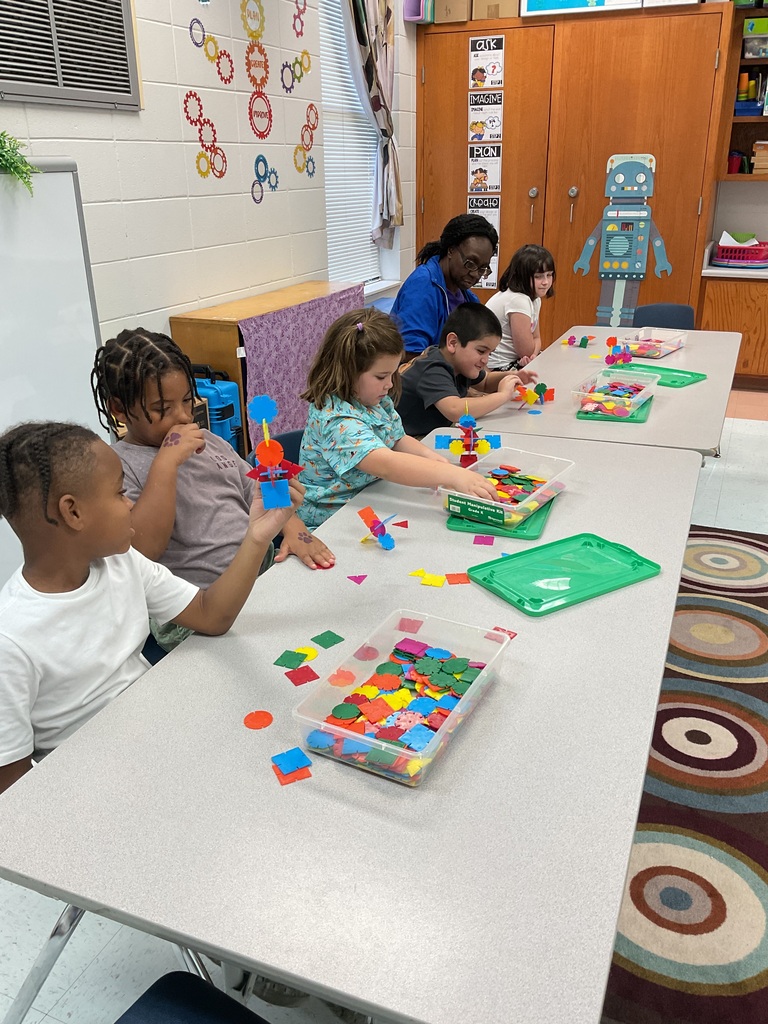 Students collaborating to create.