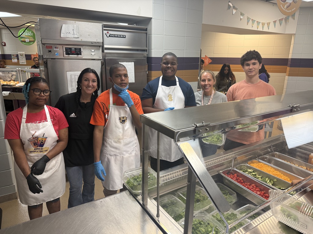 BHS Exceptional Education students prepare and serve a staff salad bar as part of a hands-on learning experience. Students wash and prepare fresh lettuce, organize toppings, assemble salads, and serve BHS staff during lunch. The salad bar features hydroponically grown lettuce from the student-led Double H Greens agriculture project, giving students an opportunity to practice food preparation, teamwork, communication, and customer service skills.