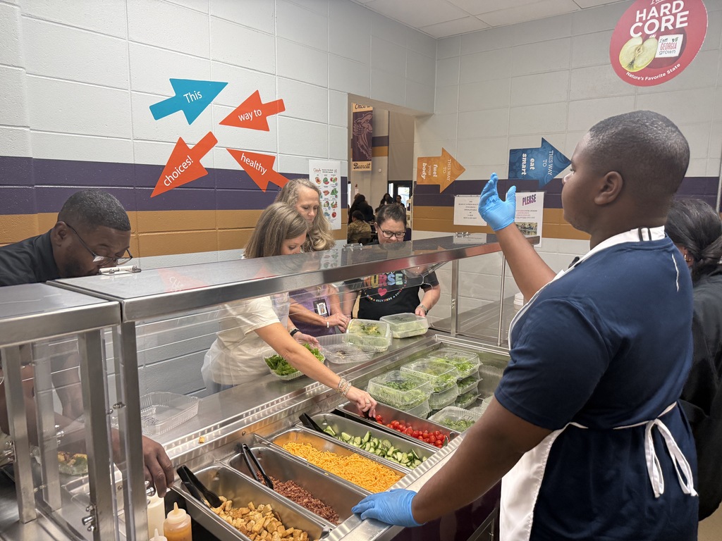 BHS Exceptional Education students prepare and serve a staff salad bar as part of a hands-on learning experience. Students wash and prepare fresh lettuce, organize toppings, assemble salads, and serve BHS staff during lunch. The salad bar features hydroponically grown lettuce from the student-led Double H Greens agriculture project, giving students an opportunity to practice food preparation, teamwork, communication, and customer service skills.