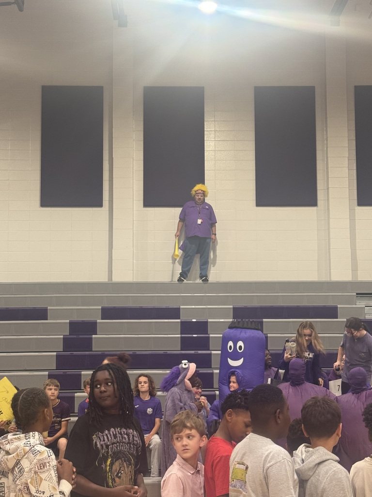 Photos from Bainbridge Middle School’s Homecoming Pep Rally featuring cheerleaders, students showing school spirit, and the BMS drumline performing in purple and gold.
