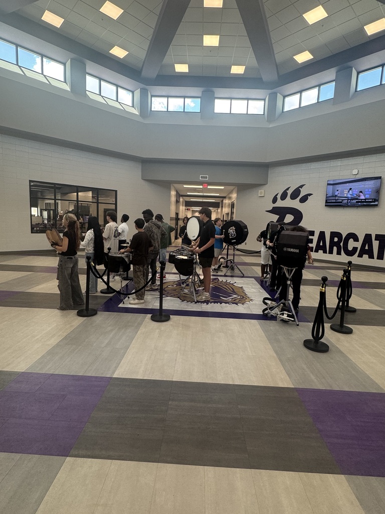 Photos from Bainbridge Middle School’s Homecoming Pep Rally featuring cheerleaders, students showing school spirit, and the BMS drumline performing in purple and gold.
