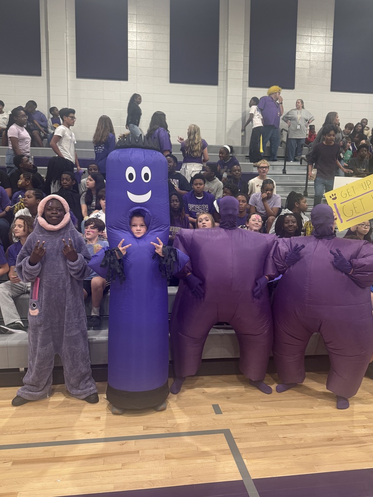 Photos from Bainbridge Middle School’s Homecoming Pep Rally featuring cheerleaders, students showing school spirit, and the BMS drumline performing in purple and gold.