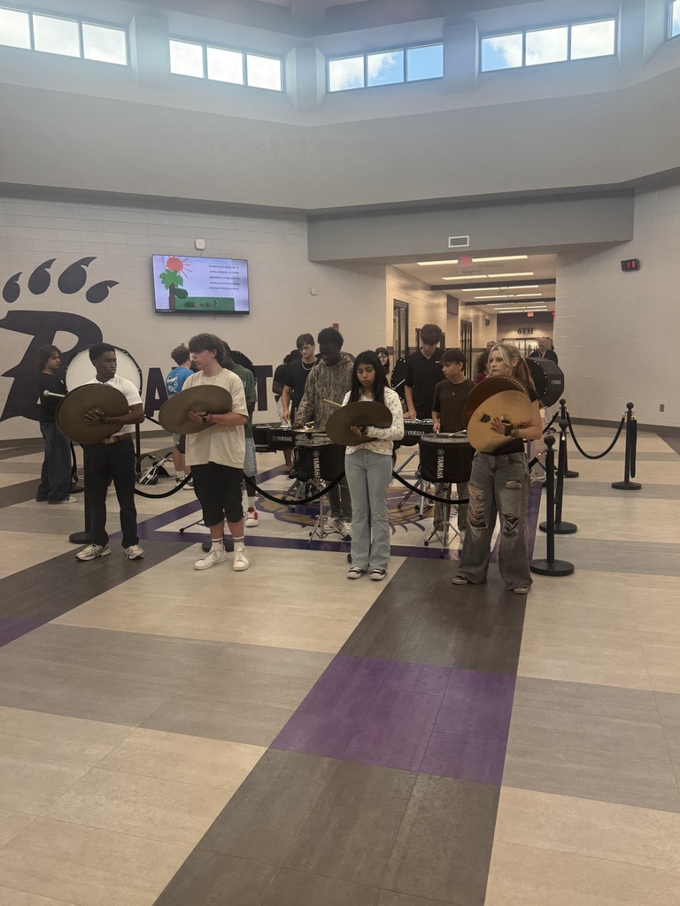 Photos from Bainbridge Middle School’s Homecoming Pep Rally featuring cheerleaders, students showing school spirit, and the BMS drumline performing in purple and gold.