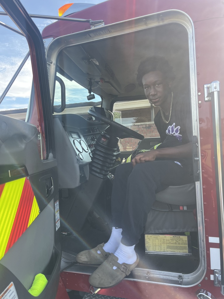 Students in the Introduction to Law and Criminal Justice Essentials classes participate in a hands-on learning experience with City of Bainbridge Fire personnel, practicing fire extinguisher use, exploring a fire truck and its equipment, and learning about fire safety, emergency response, and public safety careers.