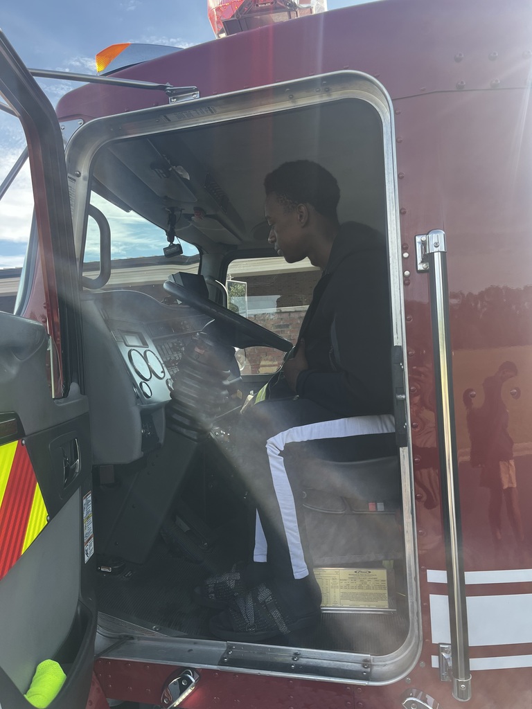 Students in the Introduction to Law and Criminal Justice Essentials classes participate in a hands-on learning experience with City of Bainbridge Fire personnel, practicing fire extinguisher use, exploring a fire truck and its equipment, and learning about fire safety, emergency response, and public safety careers.