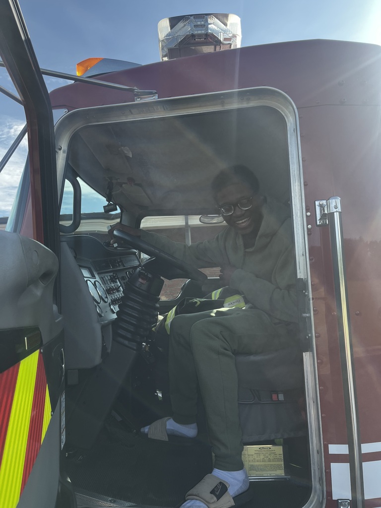 Students in the Introduction to Law and Criminal Justice Essentials classes participate in a hands-on learning experience with City of Bainbridge Fire personnel, practicing fire extinguisher use, exploring a fire truck and its equipment, and learning about fire safety, emergency response, and public safety careers.