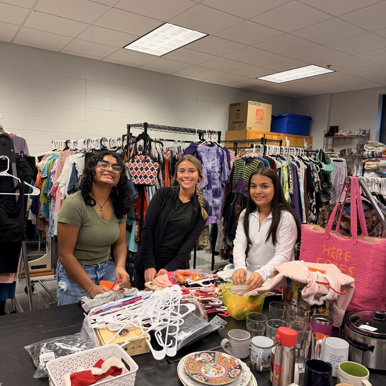 Anchor Club members worked on pricing items for the November 14th Mega Yard Sale