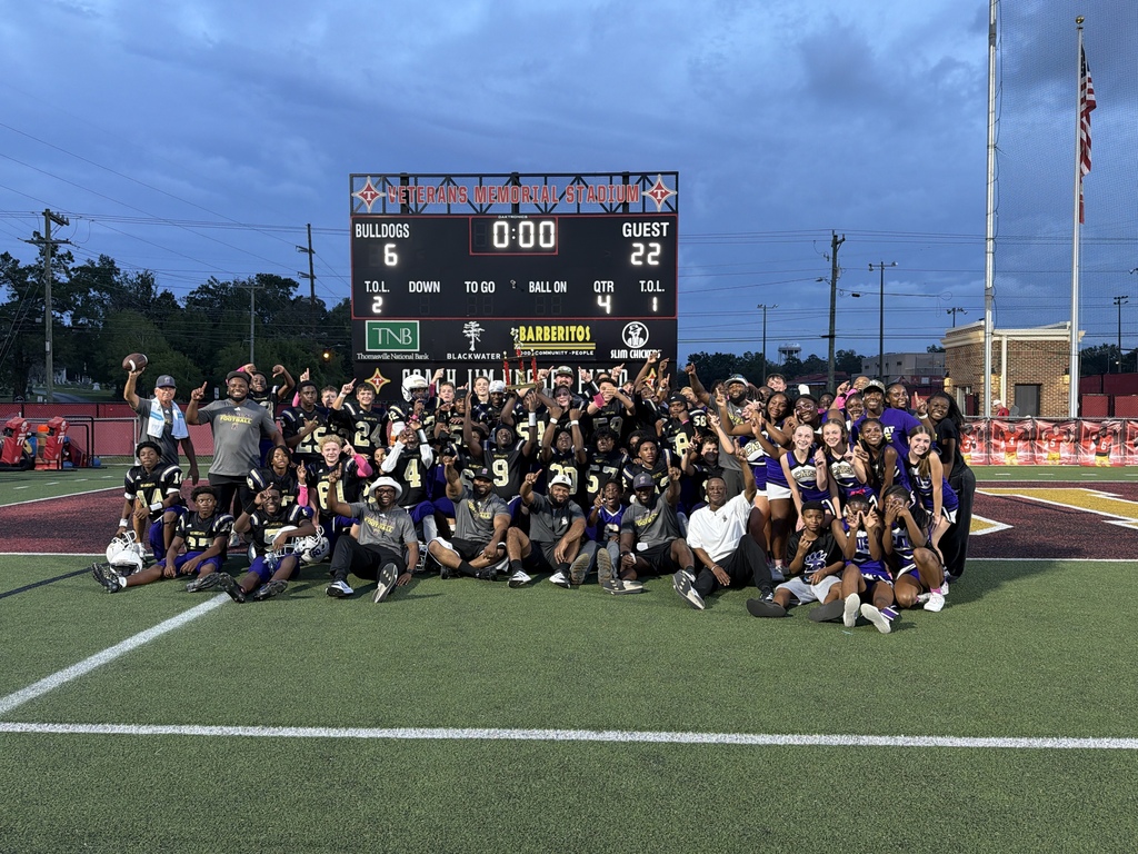 Bainbridge 8th Grade Bearcat football players, coaches, and cheerleaders celebrate their 22–6 championship victory over Thomasville at Veterans Memorial Stadium.